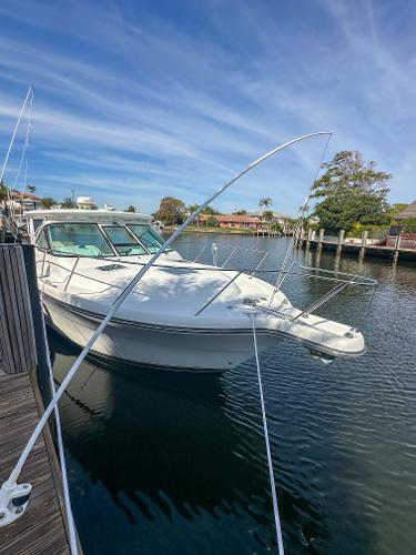 2006 Tiara Yachts 3200 Open docked in a serene marina setting.