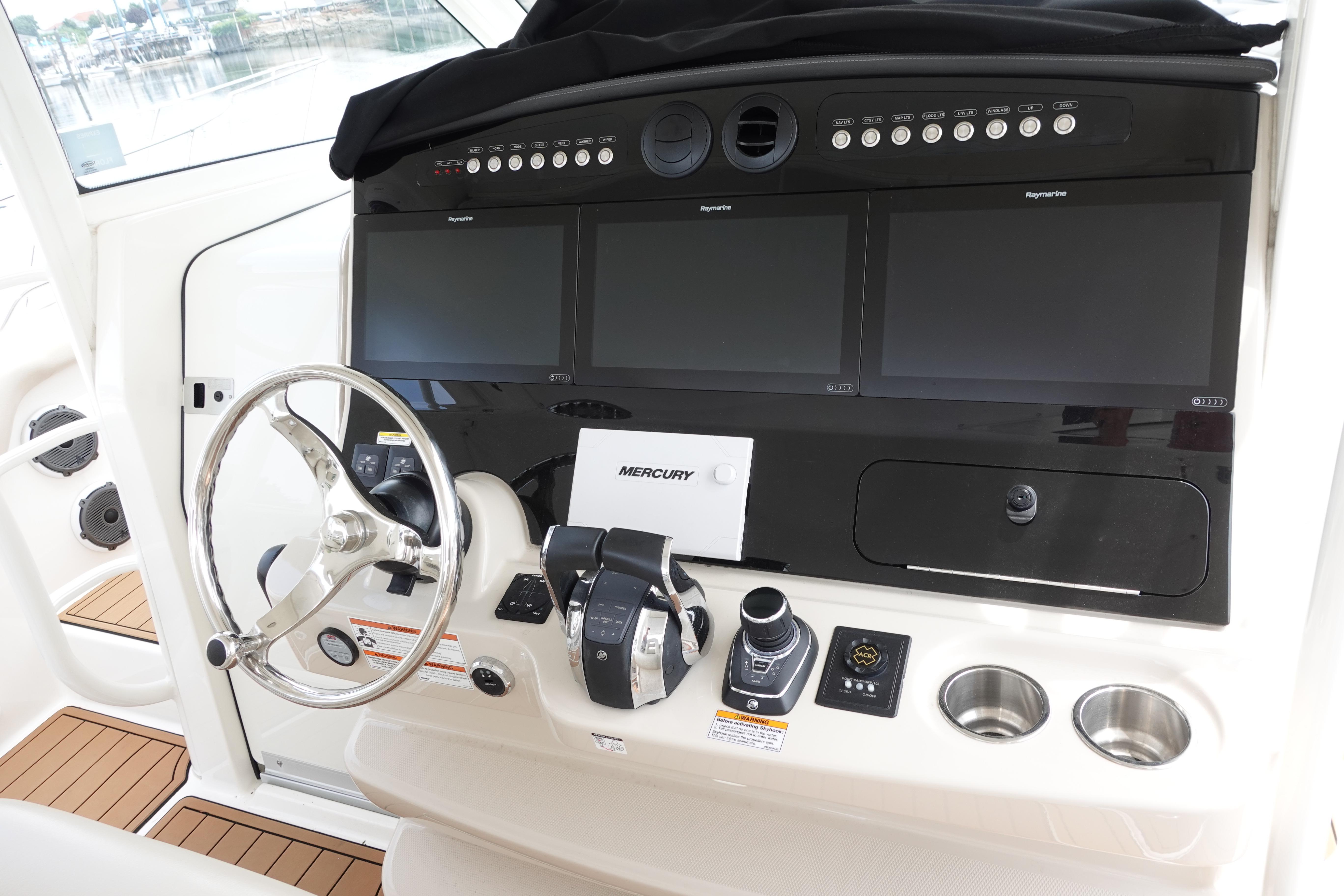 Control panel of a 2020 Boston Whaler 420 Outrage with advanced navigation displays.