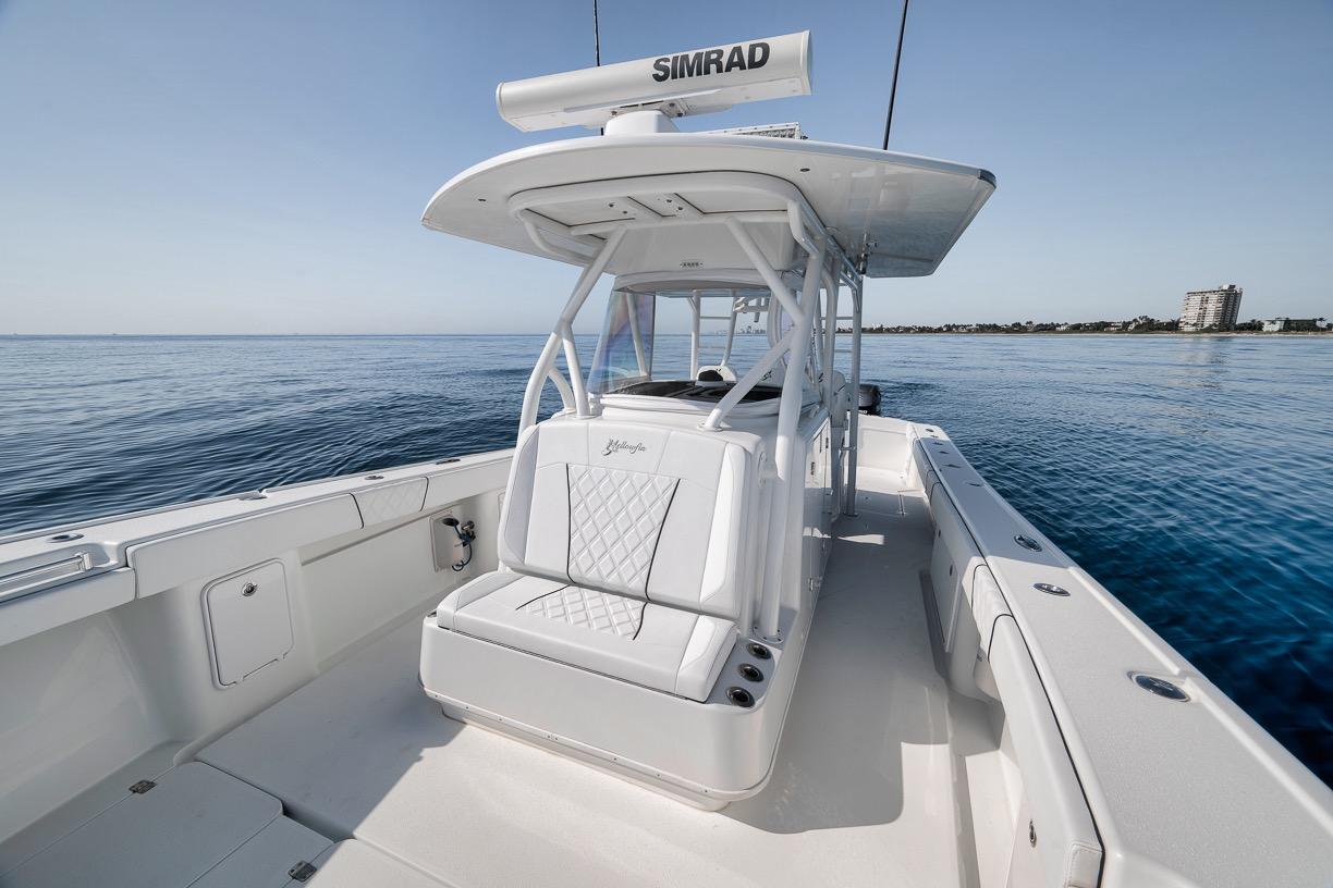 2012 Yellowfin 39 Offshore boat on calm ocean waters, featuring sleek design and spacious deck.