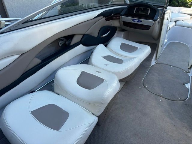 Interior of a 2006 Four Winns 190 Horizon with white and gray seating.