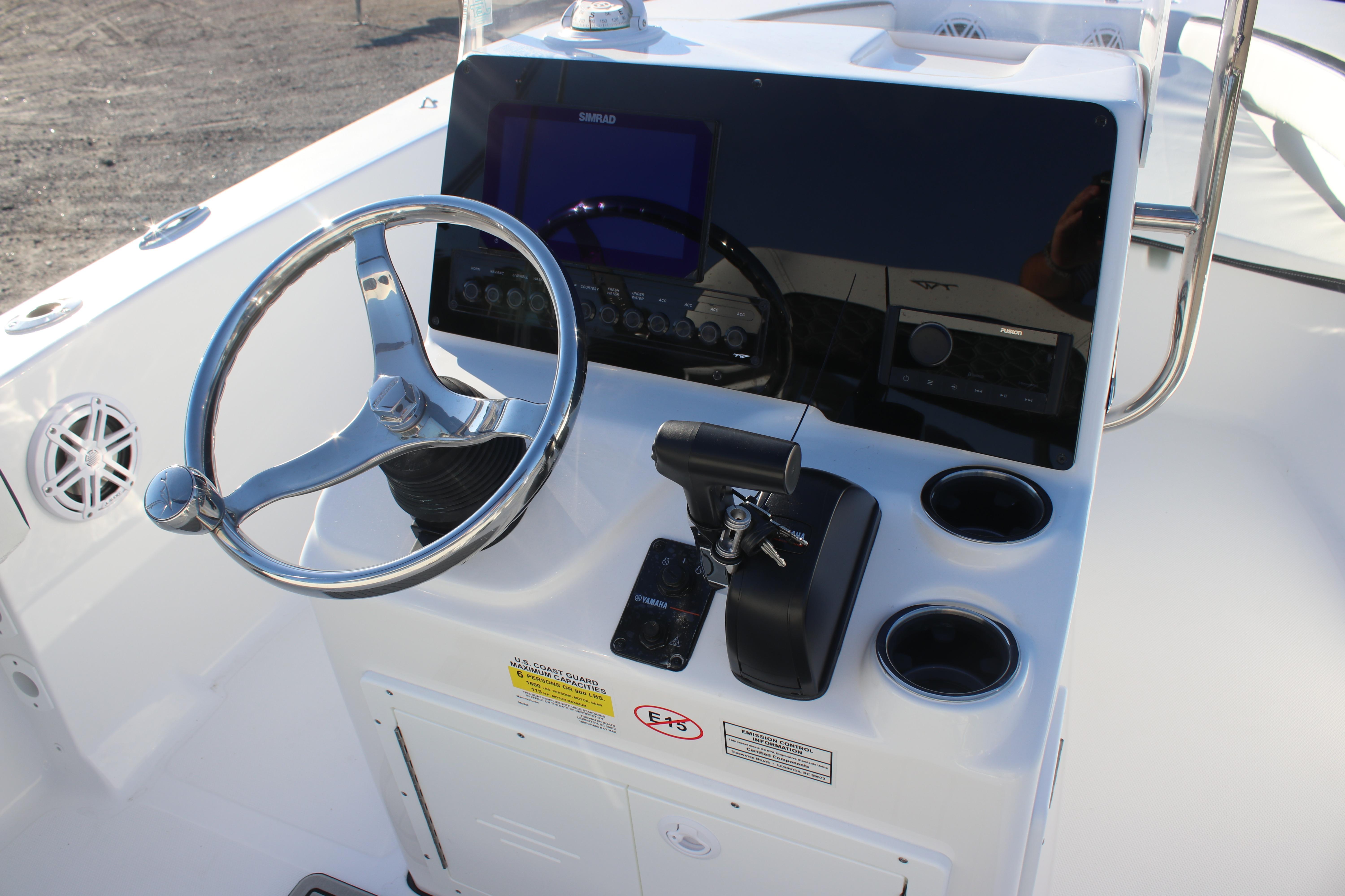 2026 Tidewater 180 CC Adventure boat console with steering wheel and controls.