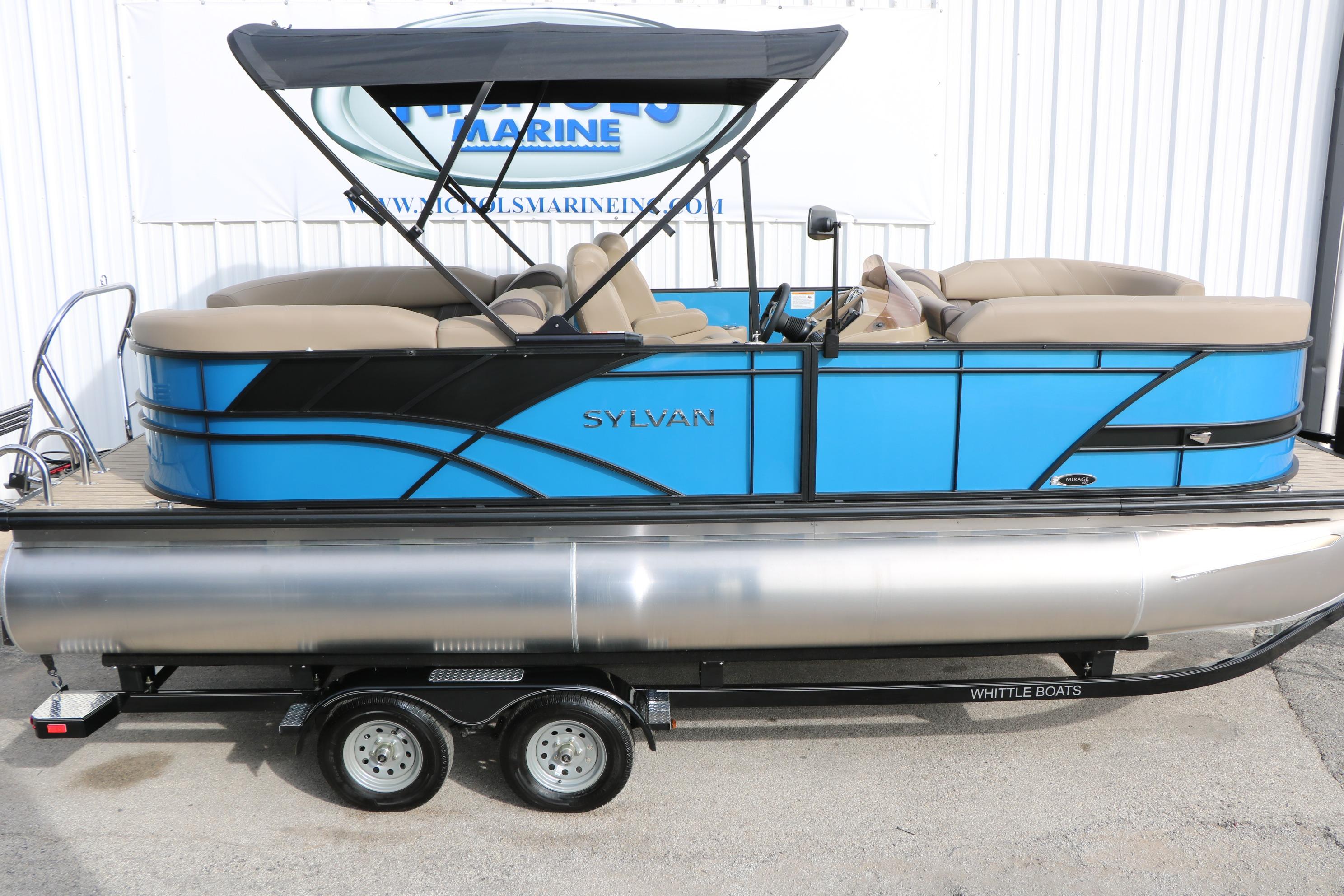 2026 Sylvan Mirage 822 LZ pontoon boat with blue and black design on trailer.