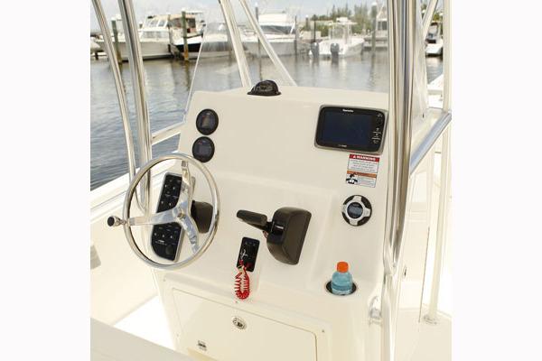 Manufacturer Provided Image: 2018 Cobia 201 Center Console boat dashboard with steering wheel and navigation equipment.