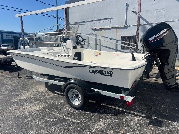 2025 Mako Pro Skiff 15 CC boat with Mercury outboard motor on trailer.