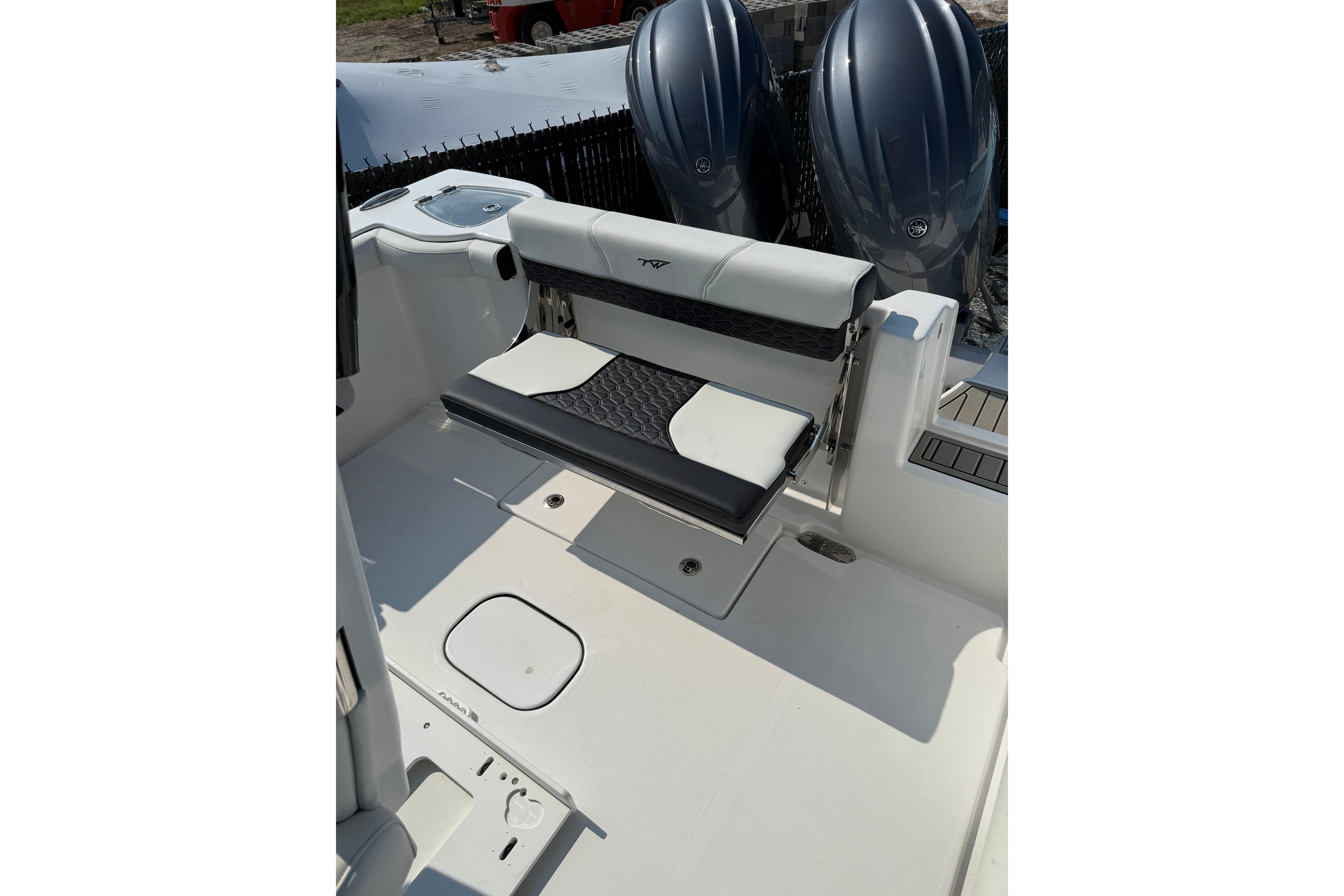 2026 Tidewater 256 CC Adventure boat interior with seating and dual engines.