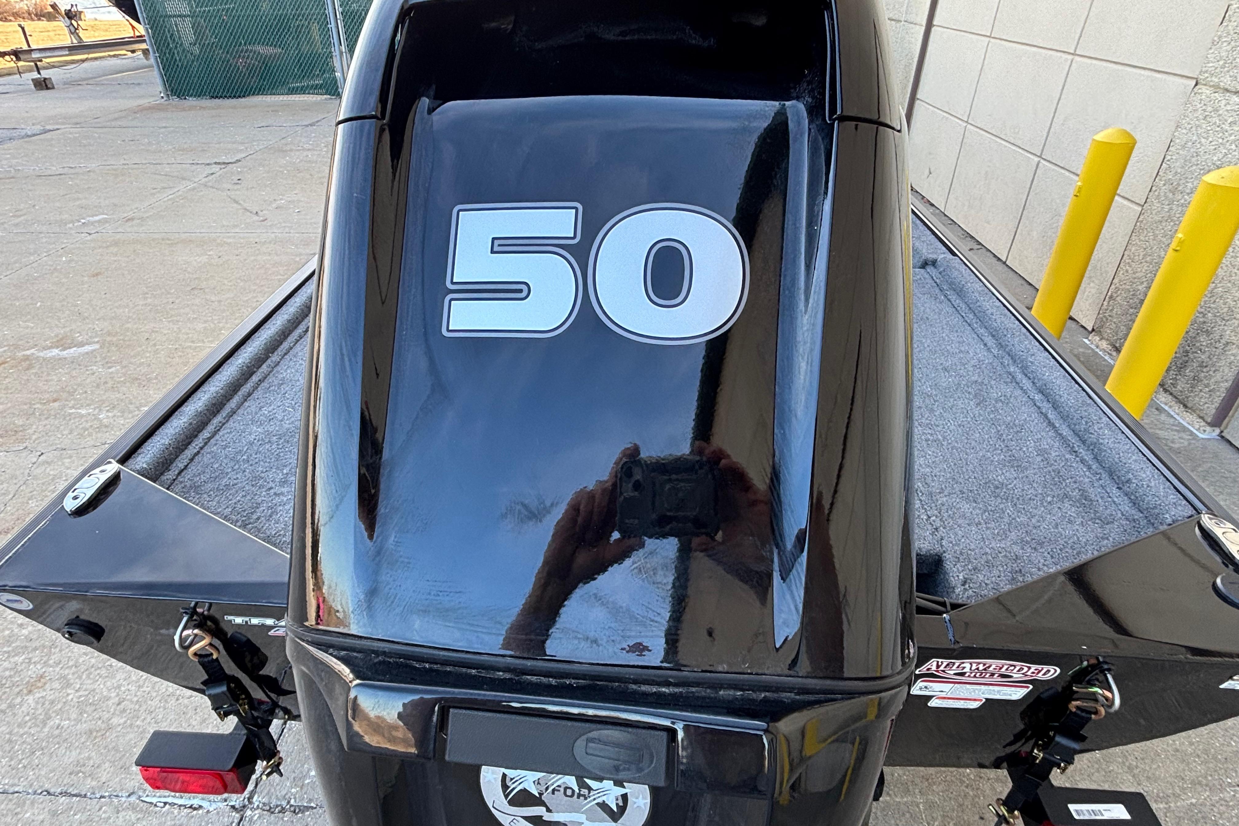 2026 Tracker Bass Tracker Classic XL boat with "50" on the motor, parked outdoors.