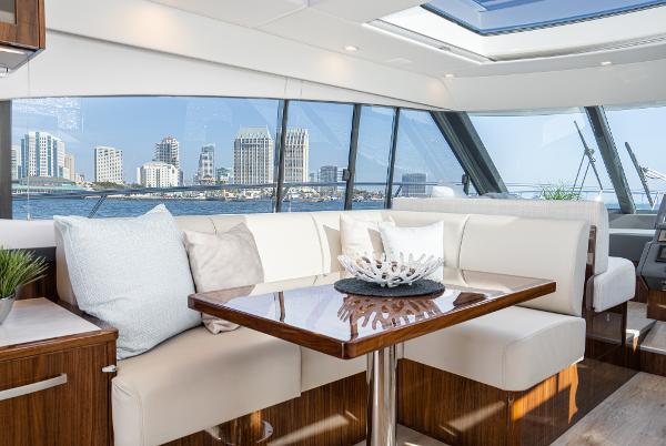 Luxurious interior of 2021 Riviera 5400 Sport Yacht with city skyline view.