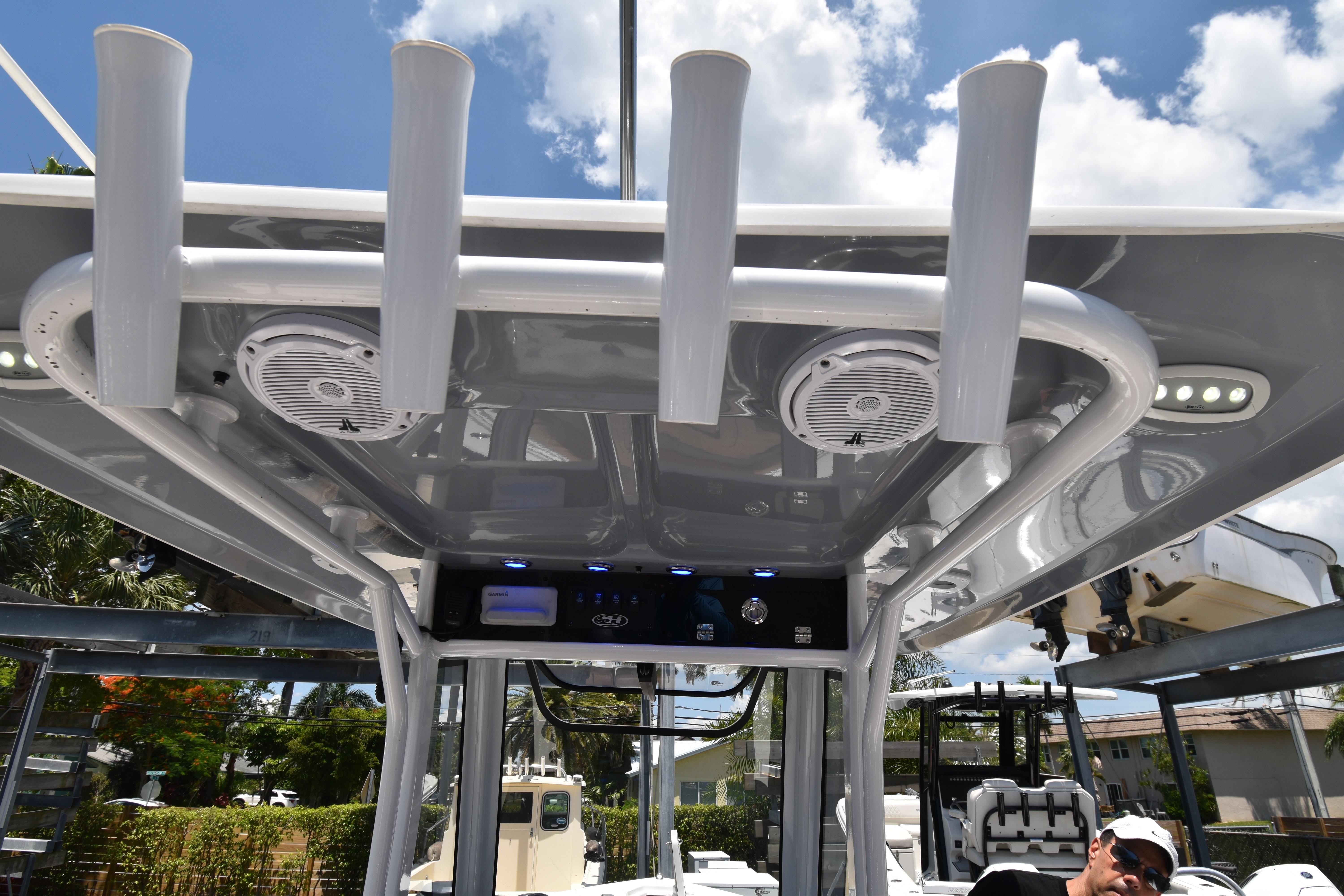 2020 Sea Hunt Ultra 275 SE boat with rod holders and speakers under T-top.