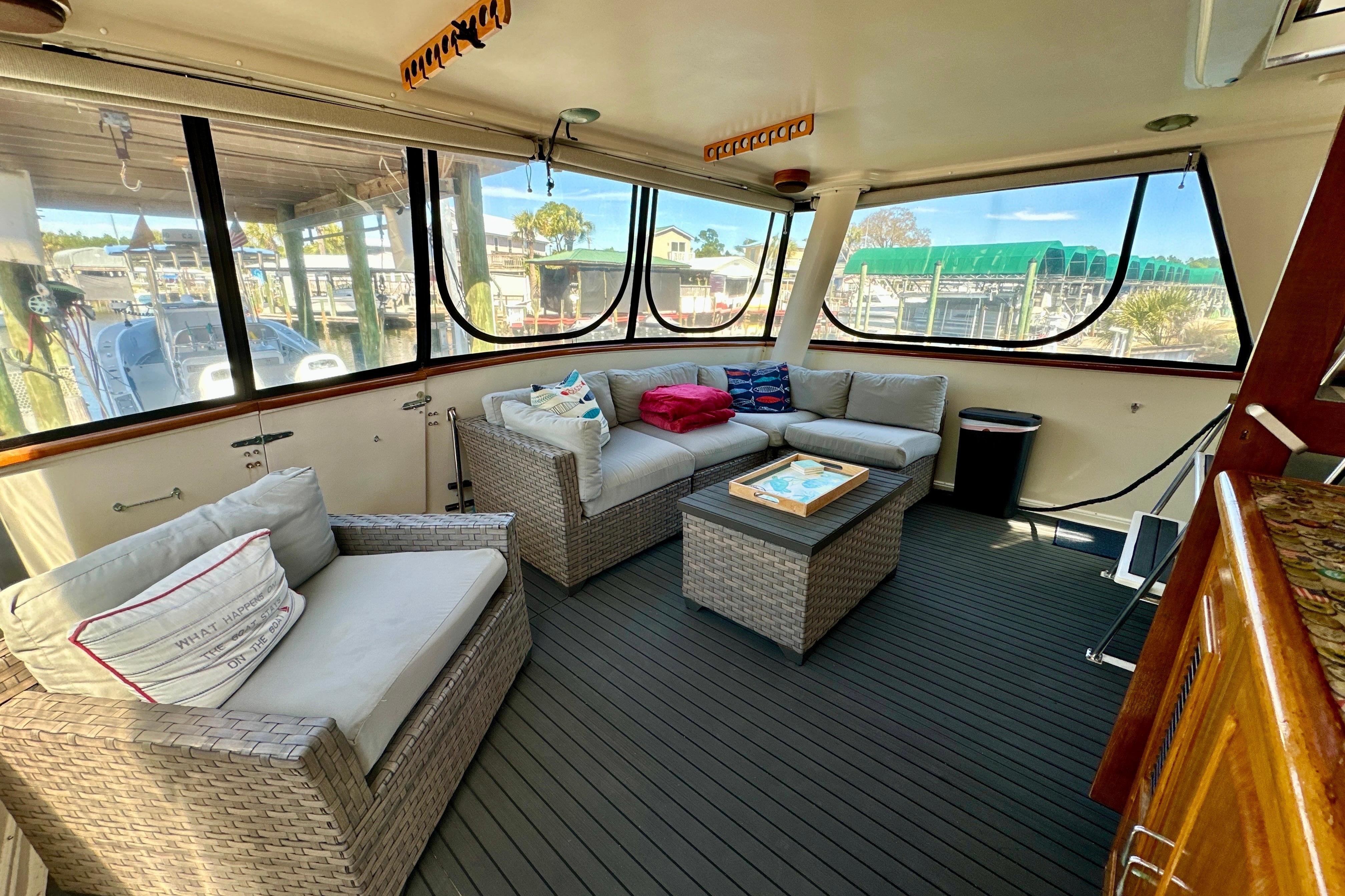 Luxurious interior of 1988 Californian 45 Motor Yacht with comfortable seating and panoramic windows.