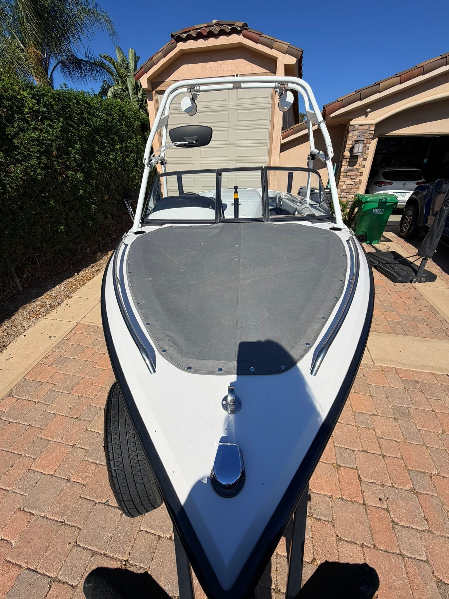 1996 Correct Craft Tournament boat parked on driveway.