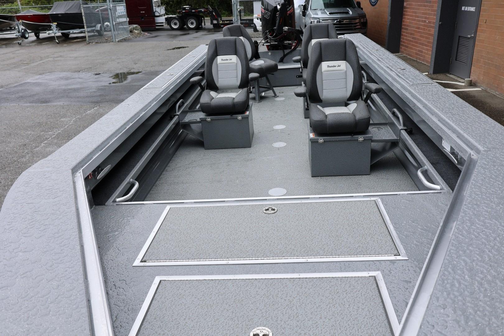 2026 Thunder Jet 229 Rush OT boat interior with seating and storage compartments.