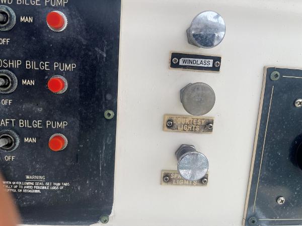 Control panel of a 1985 Hatteras 45 Convertible boat with bilge pump switches.