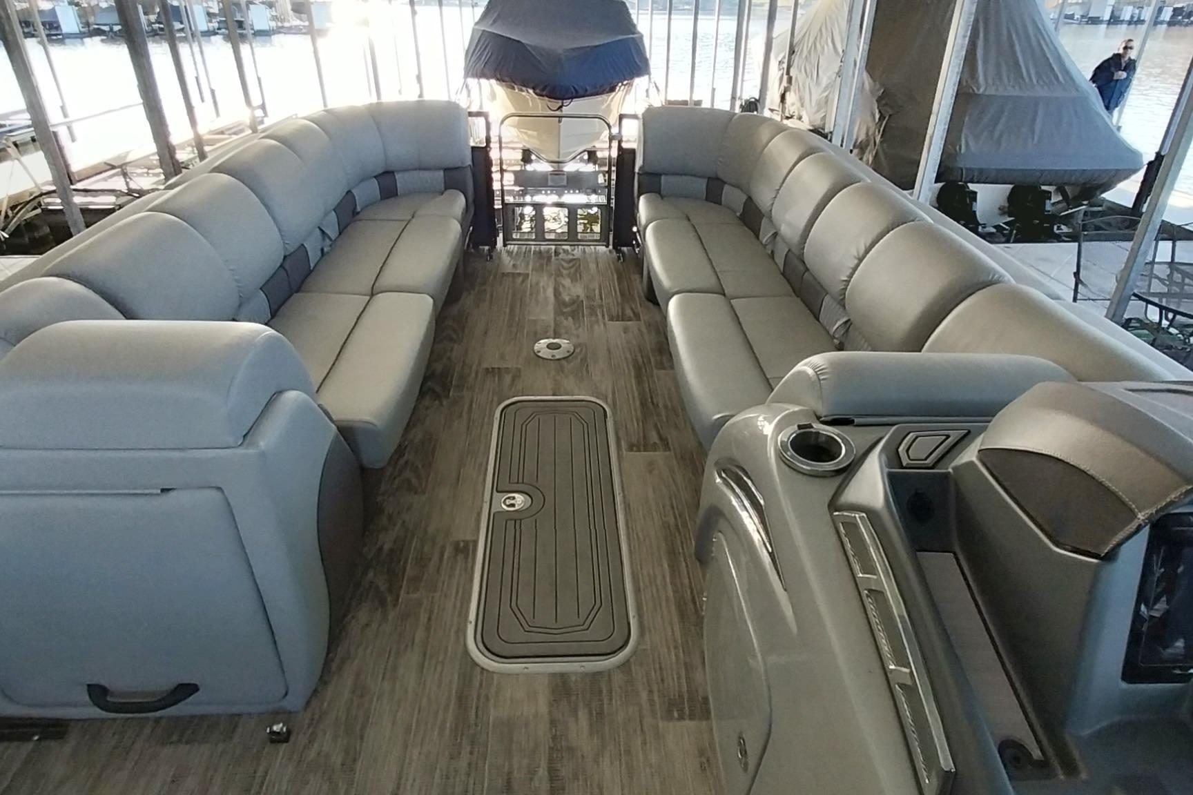Luxurious interior of 2023 Ranger 2500LS pontoon boat with plush seating and modern design.