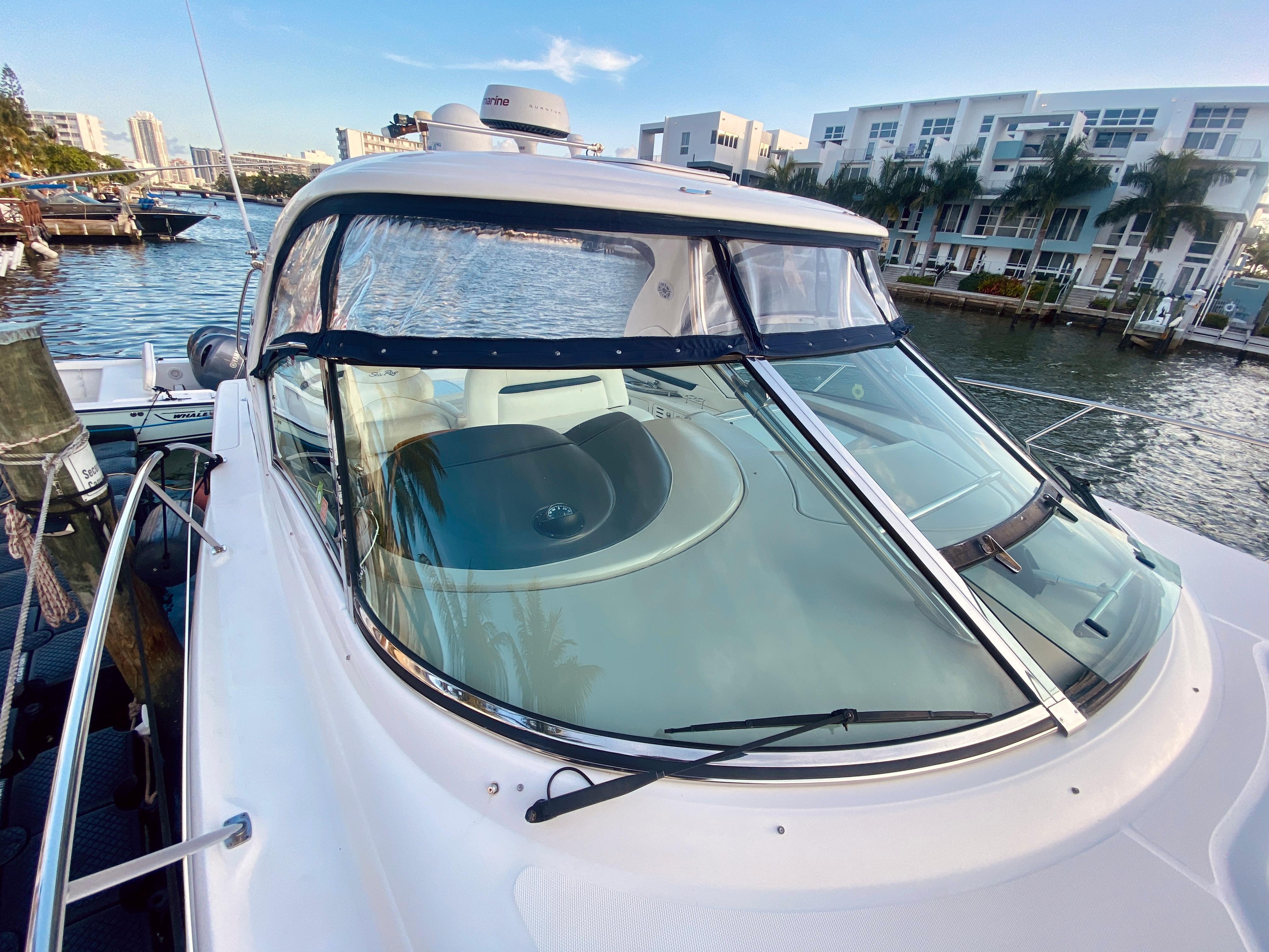 2005 Sea Ray 420 Sundancer yacht docked in a marina.