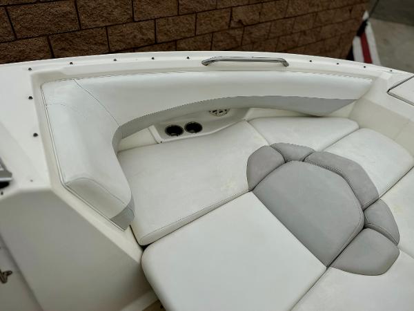 2006 Larson LXi 248 boat interior with white and gray seating.
