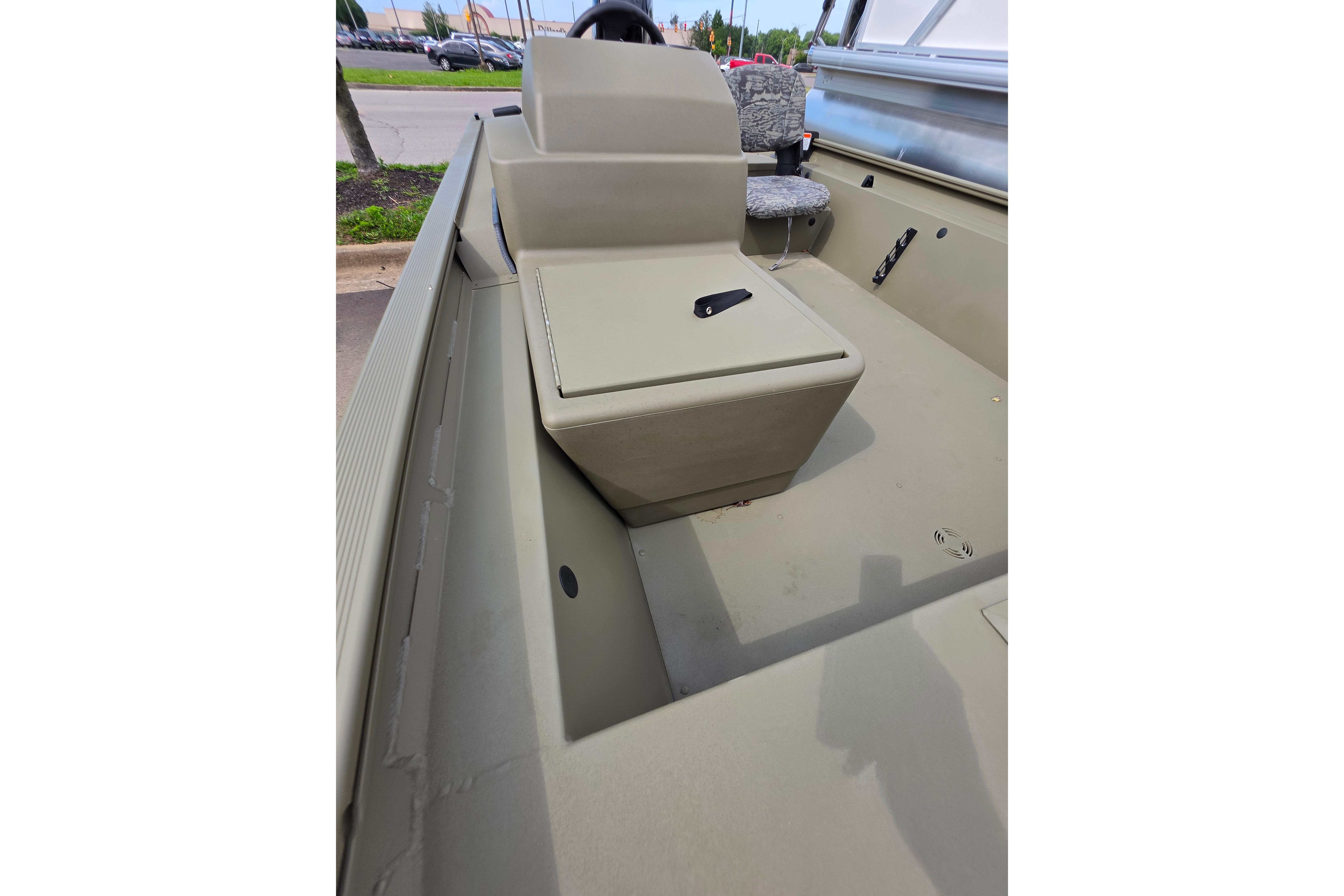 2026 Tracker Grizzly 1754 SC boat interior with seating and steering console.