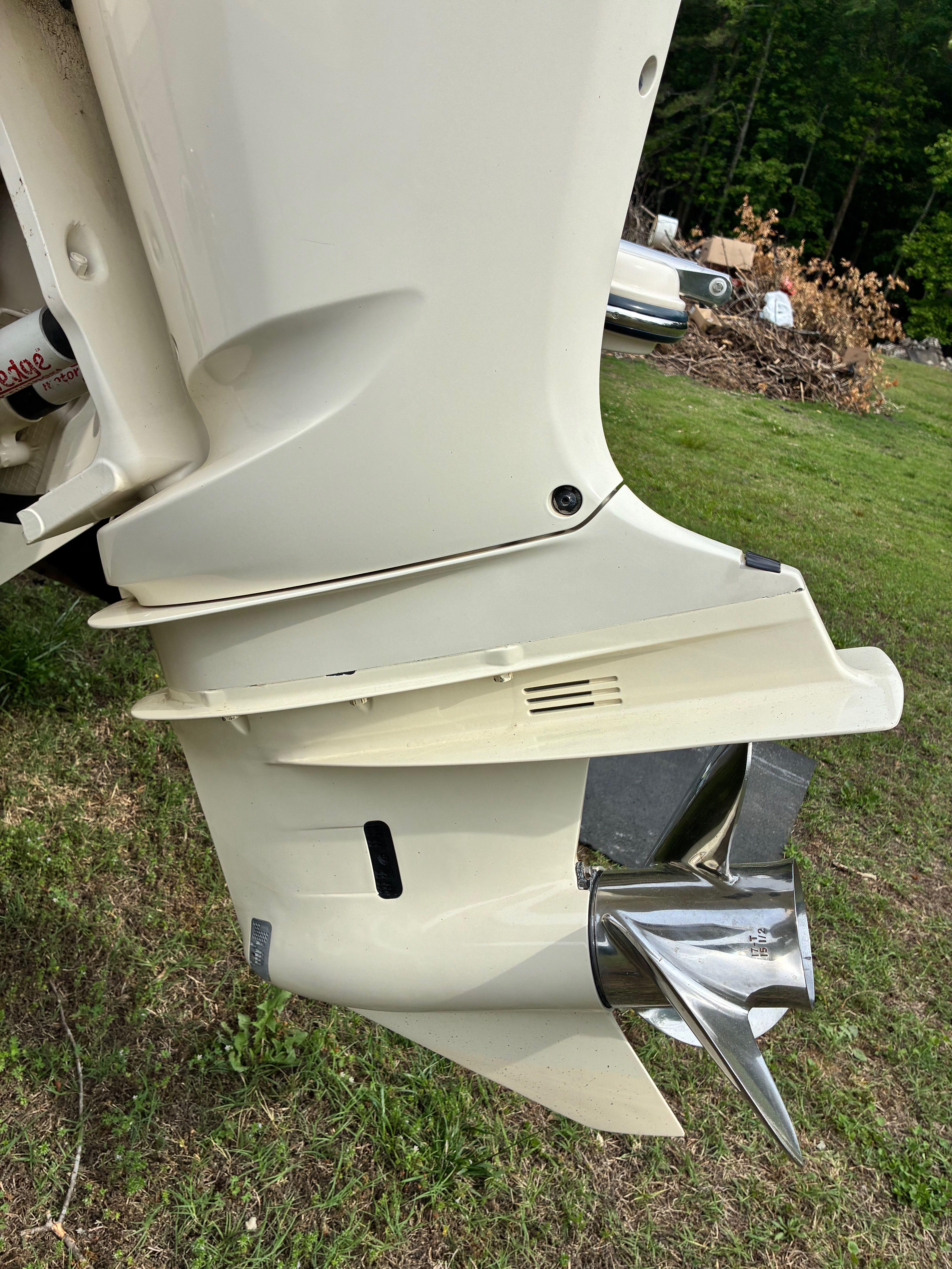 2018 Grady-White Freedom235 outboard motor on grass.