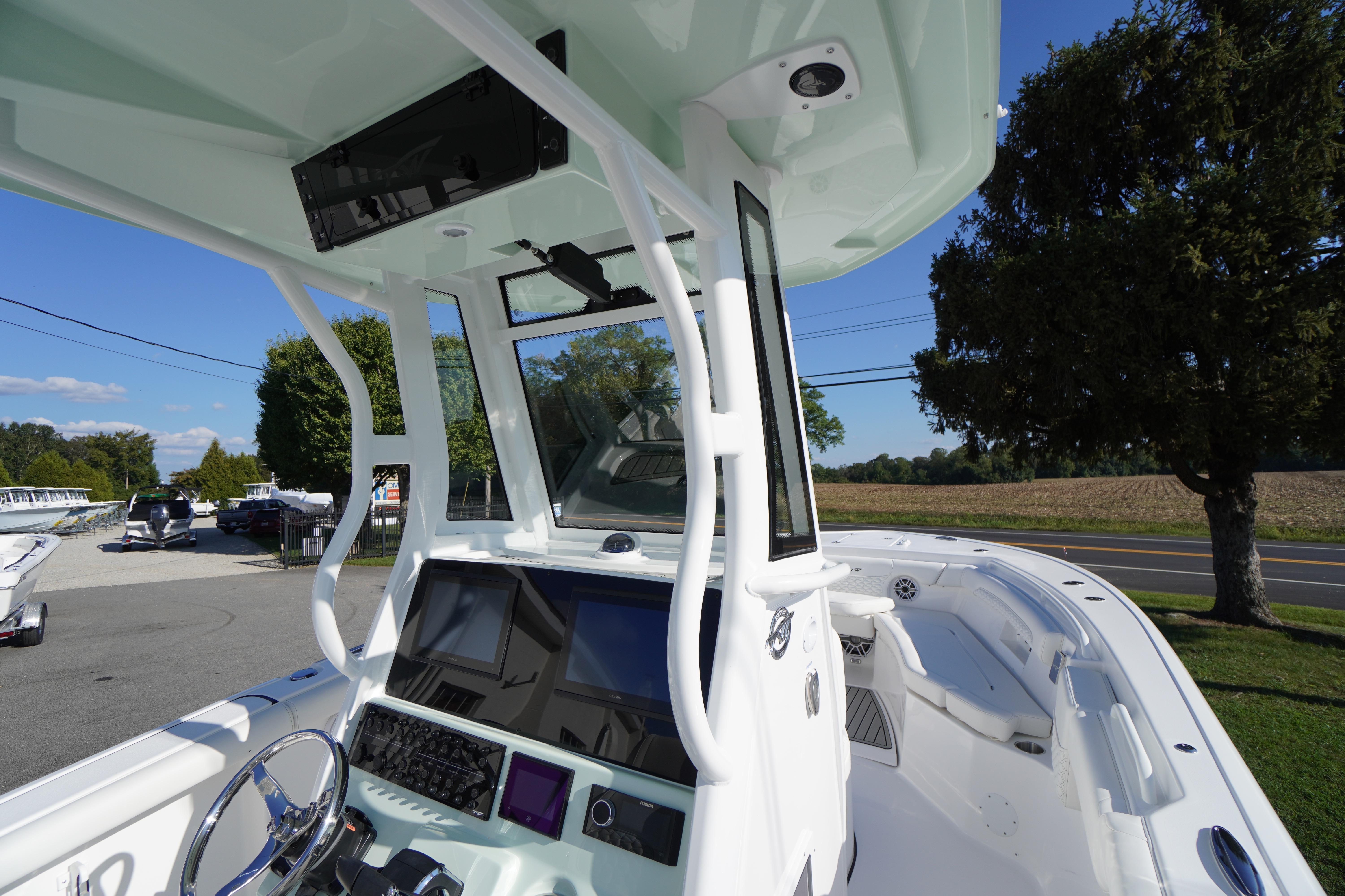 2026 Tidewater 272 LXF boat interior with modern dashboard and spacious seating.