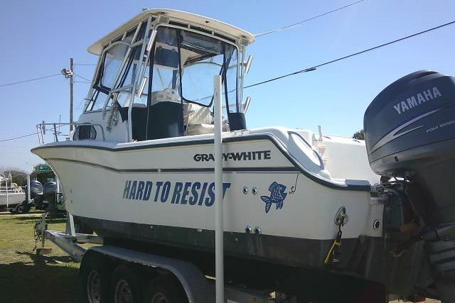 2004 Grady White 27 Islander boat on trailer with Yamaha outboard motor.