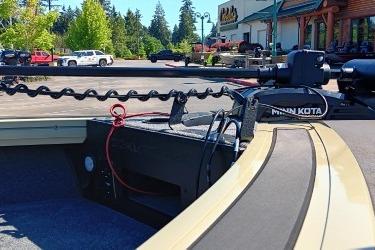 2026 Tracker Targa V-19 Combo boat with Minn Kota trolling motor in parking lot.