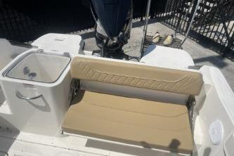 2023 Trophy T24 CC boat interior with beige seating and storage compartments.
