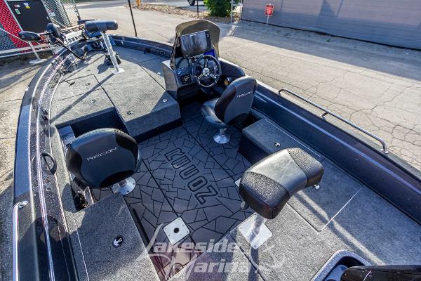 2024 Recon 985 SC fishing boat interior with seating and control console.