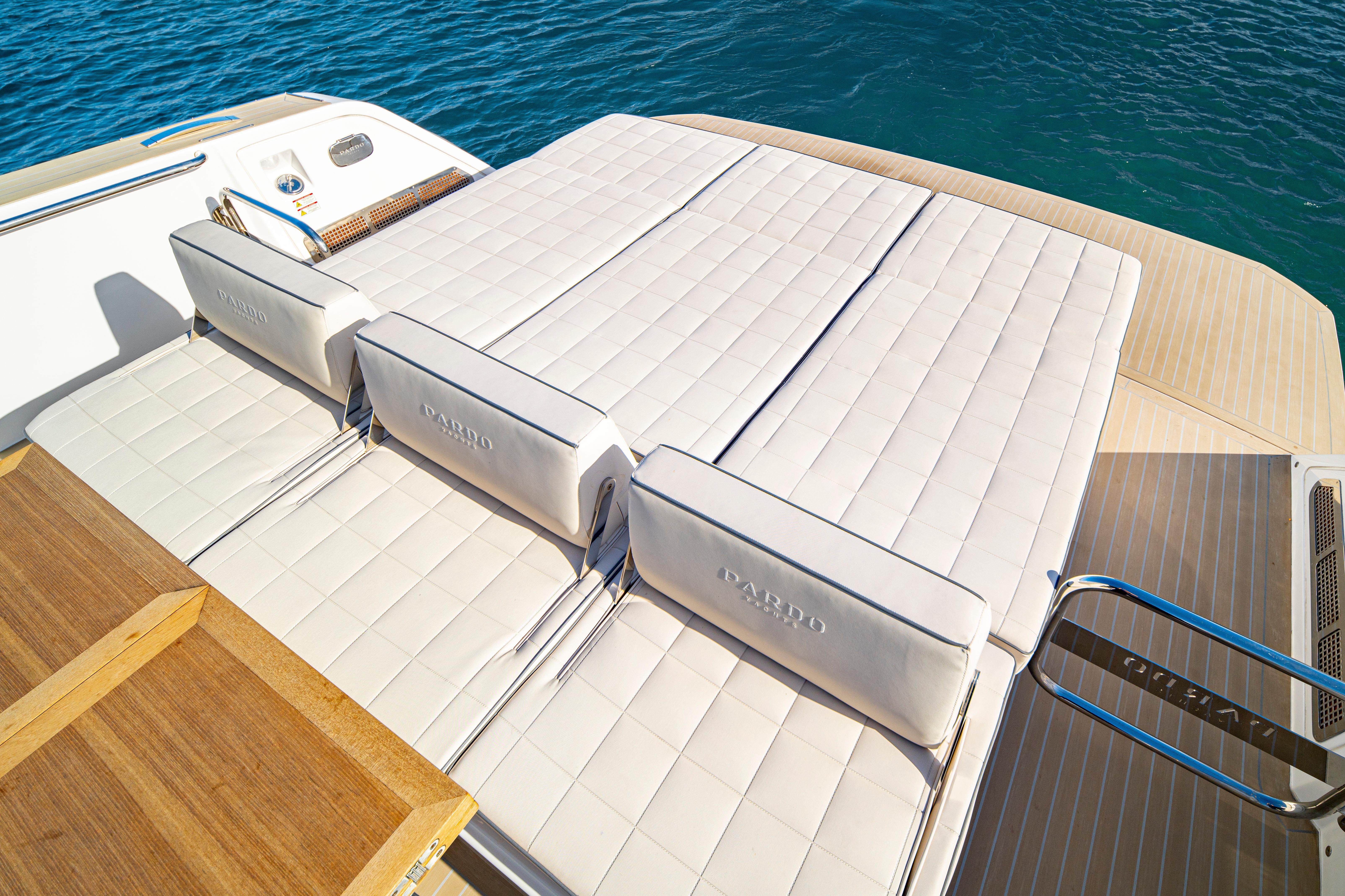 2024 Pardo Yachts P43 sun deck with luxurious white cushions on blue water.