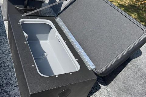 2026 Tracker Panfish 17 boat storage compartment with open lid, showcasing interior space.