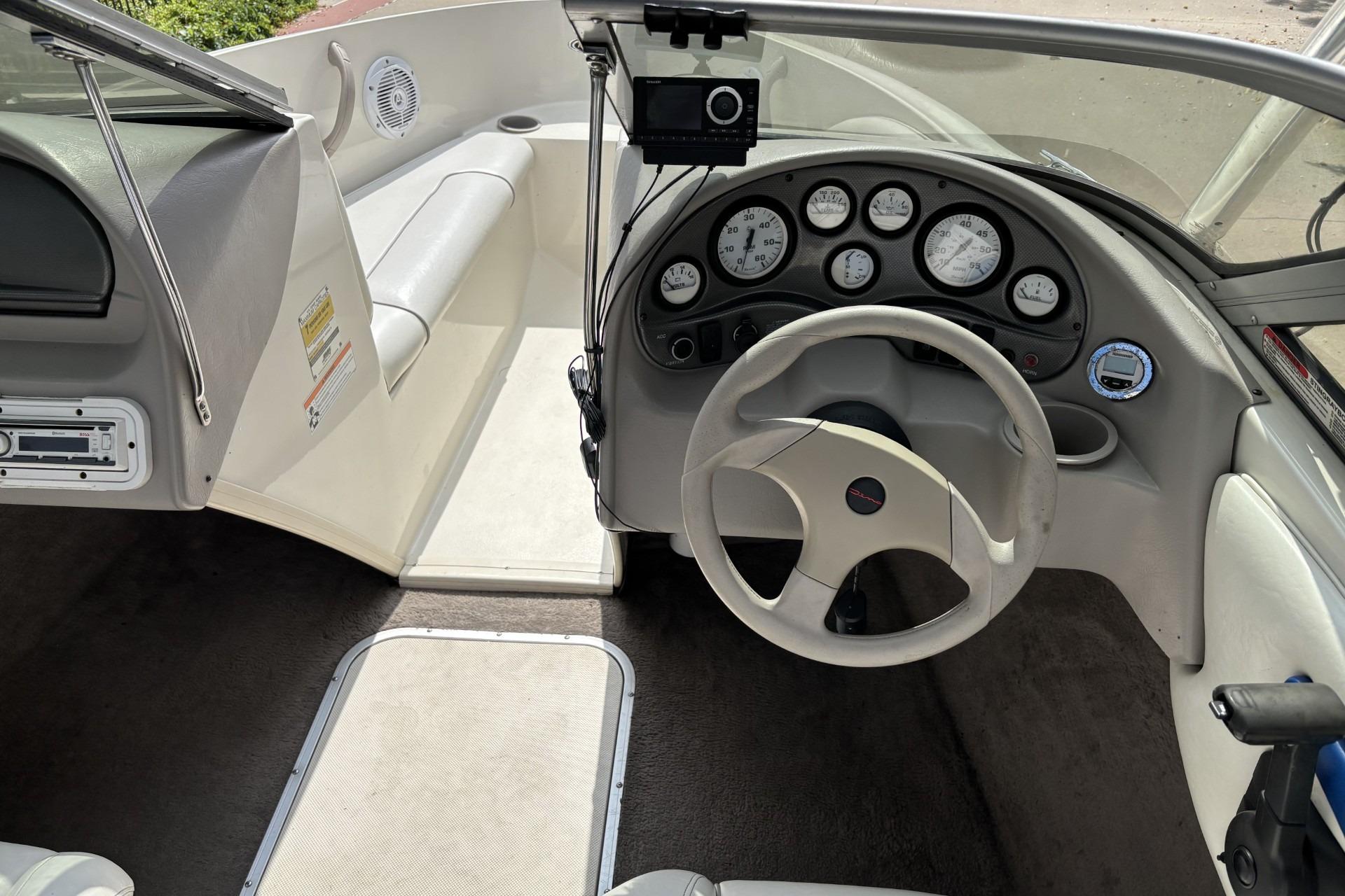 2007 Stingray 180 RX boat interior with steering wheel and dashboard gauges.