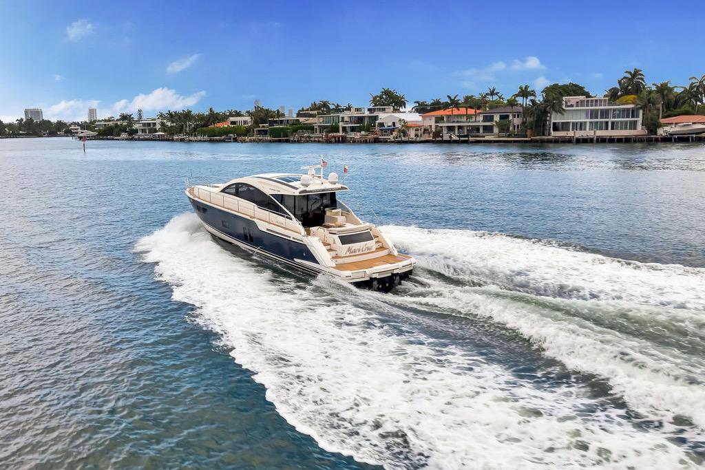 Luxury Fairline Targa 58 yacht cruising on a scenic waterway, 2012 model.