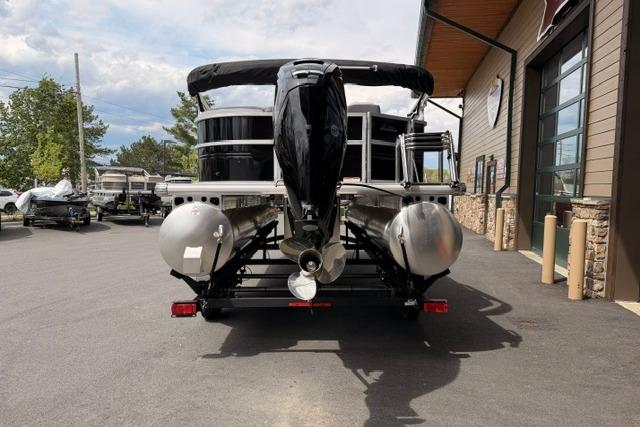 2026 Sun Tracker Party Barge 20 DLX pontoon boat on trailer, rear view.