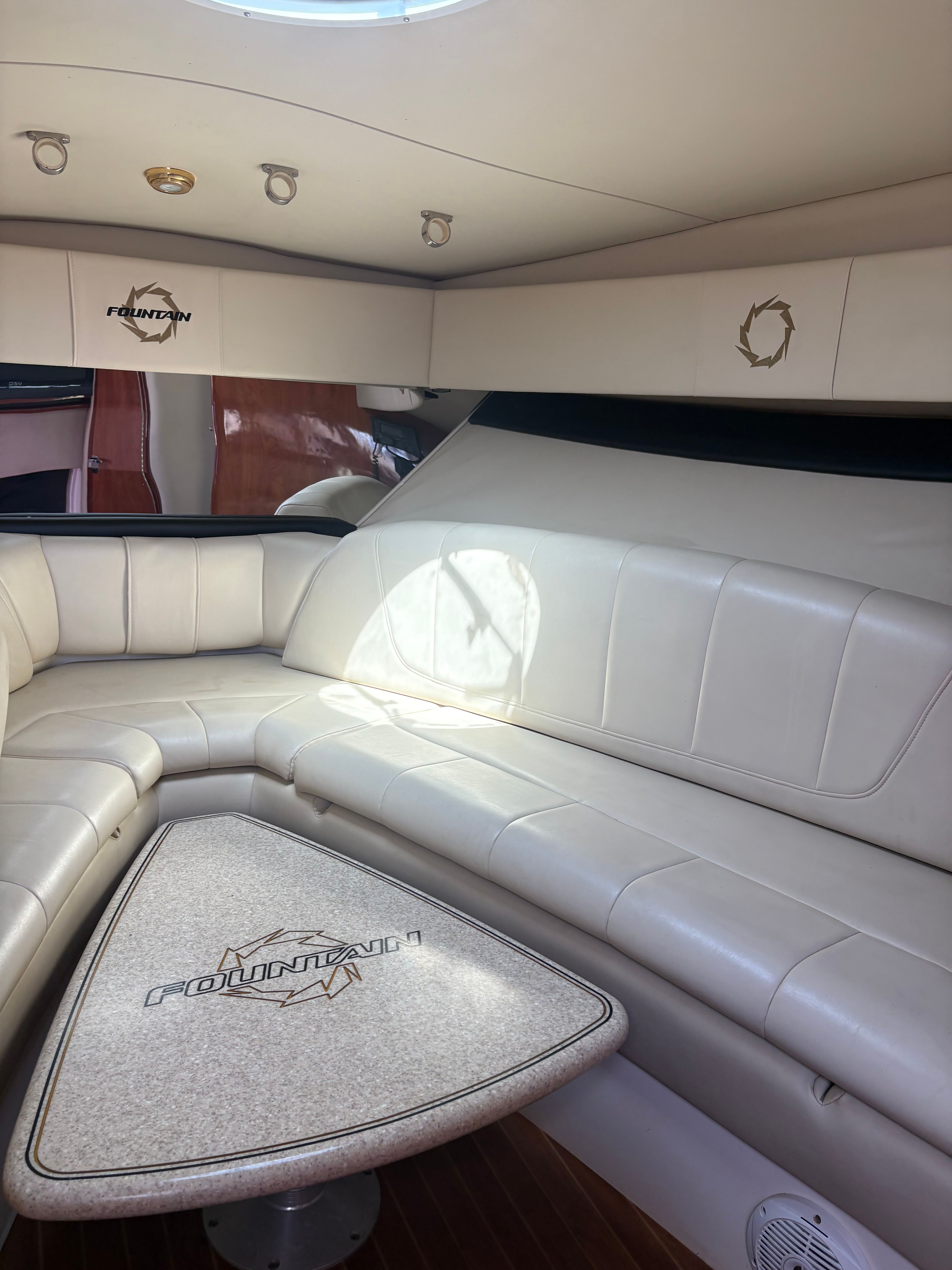 Interior of a 2009 Fountain 33 Sportfish Cruiser with leather seating.
