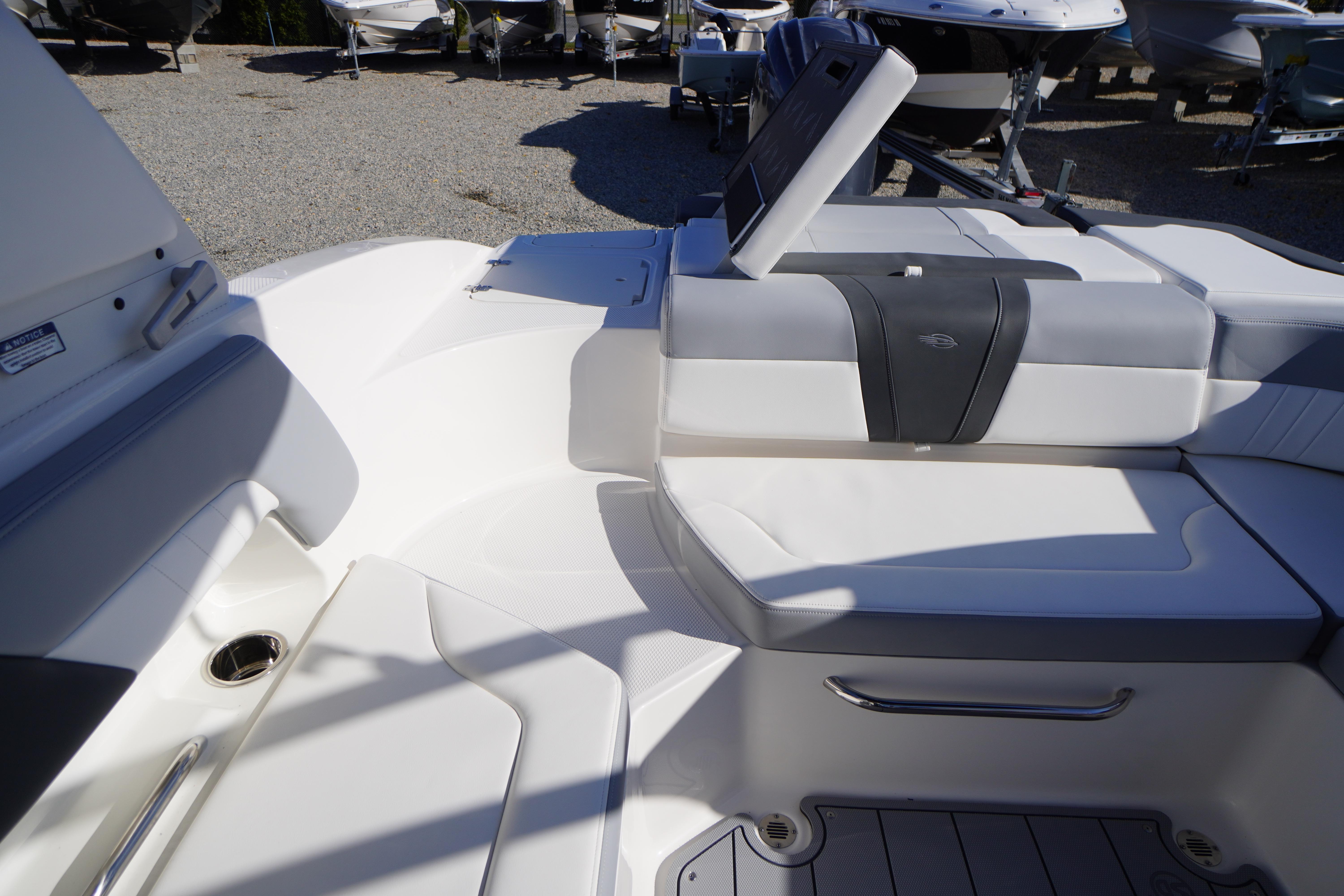 2026 Chaparral 23 SSi OB boat interior with white seating and modern design.