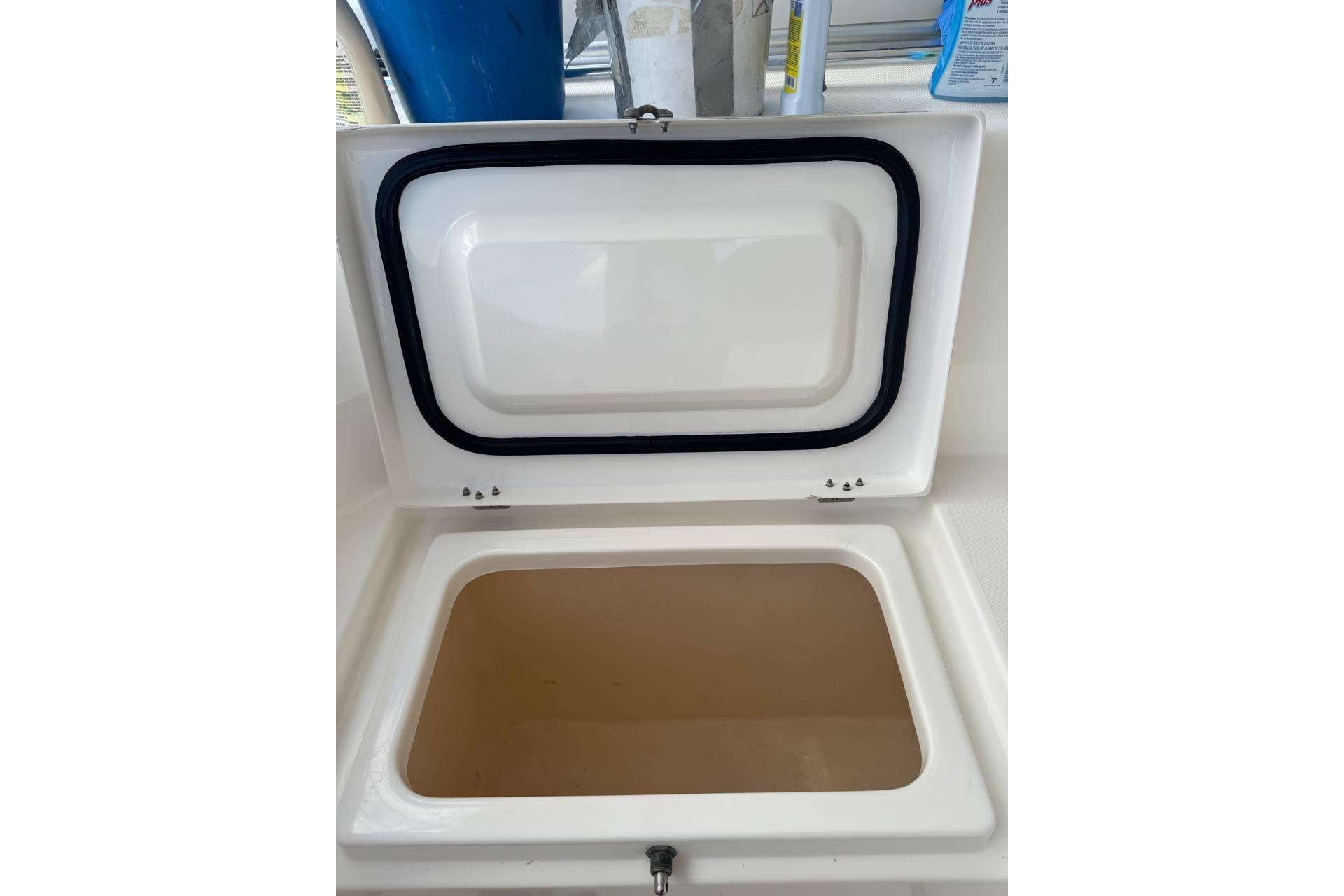 Open storage compartment on a 2017 Leopard 45 yacht, featuring a sealed lid.