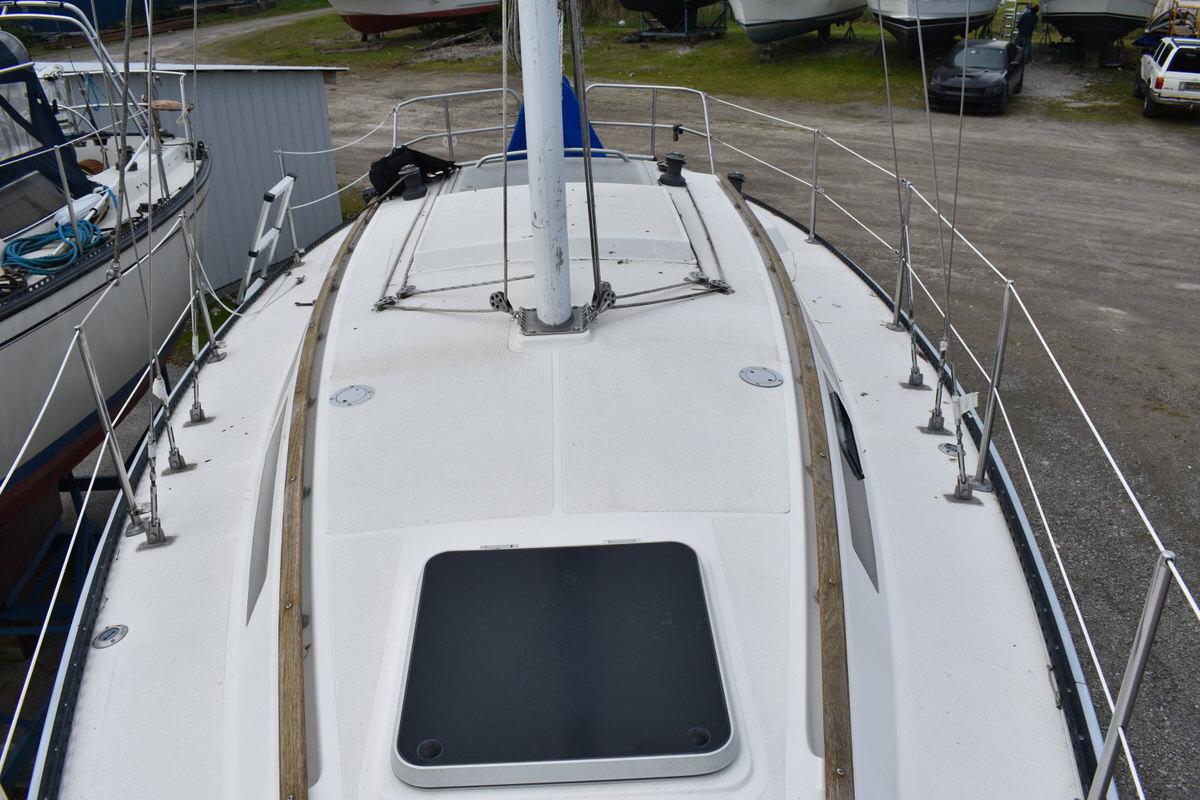 Deck view of a 1987 S2 9.2A sailboat, situated in a dry dock.