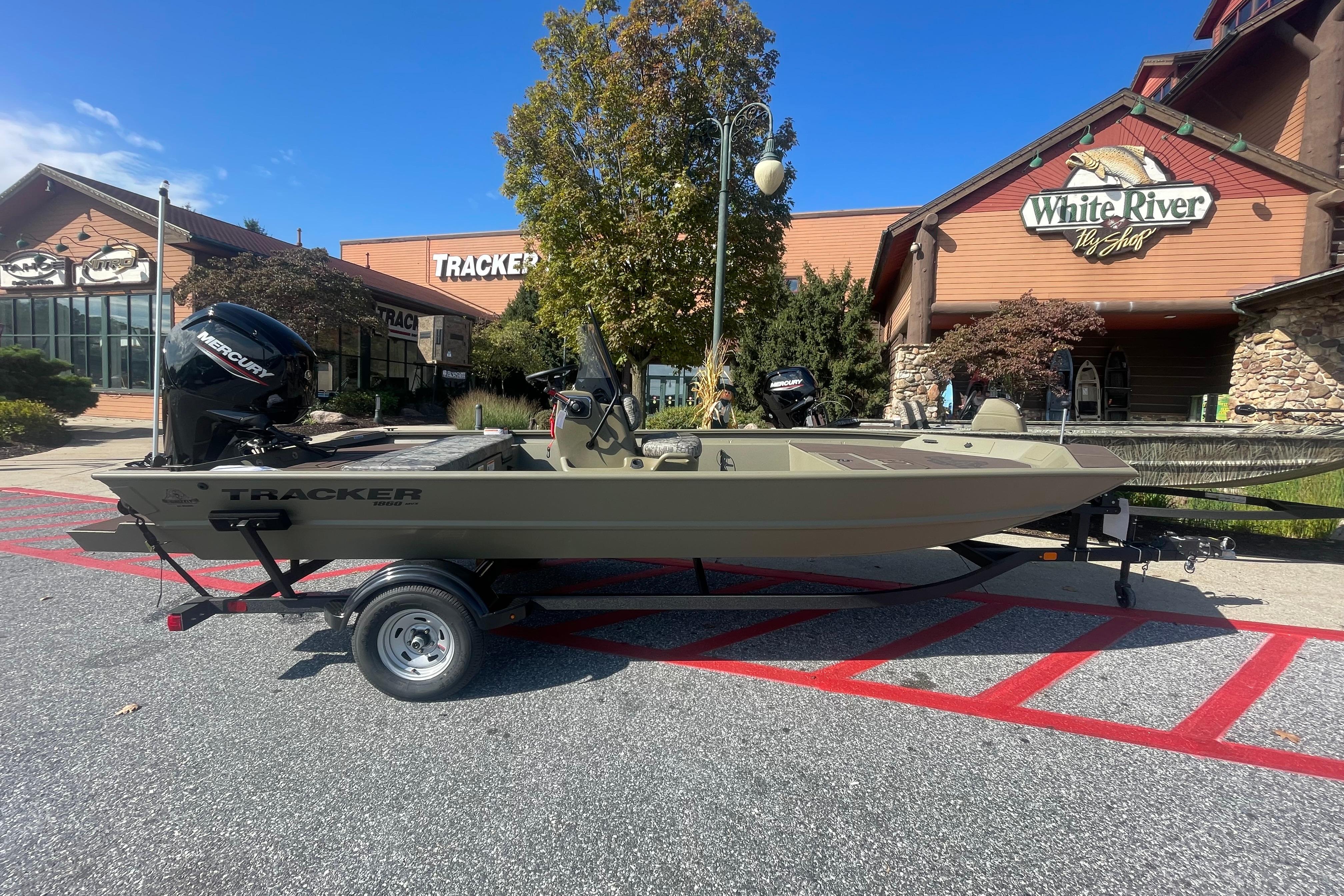 2026 Tracker Grizzly 1860 CC boat on trailer outside White River Fly Shop.