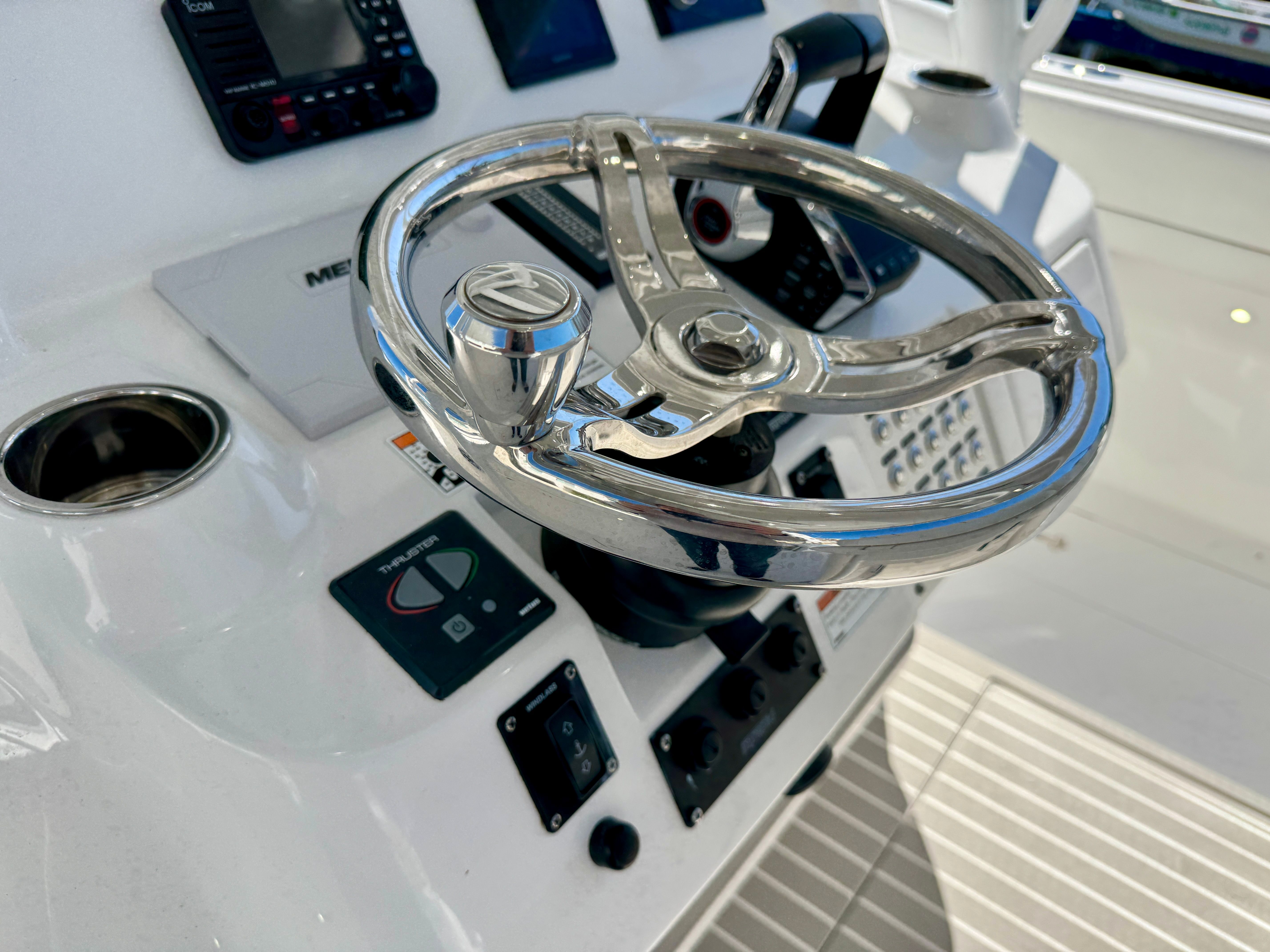 Intrepid 407 Nomad FE 2024 helm with shiny steering wheel.