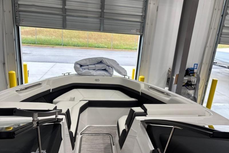 2025 Cobalt R6 boat interior in a garage, featuring sleek seating and modern design.