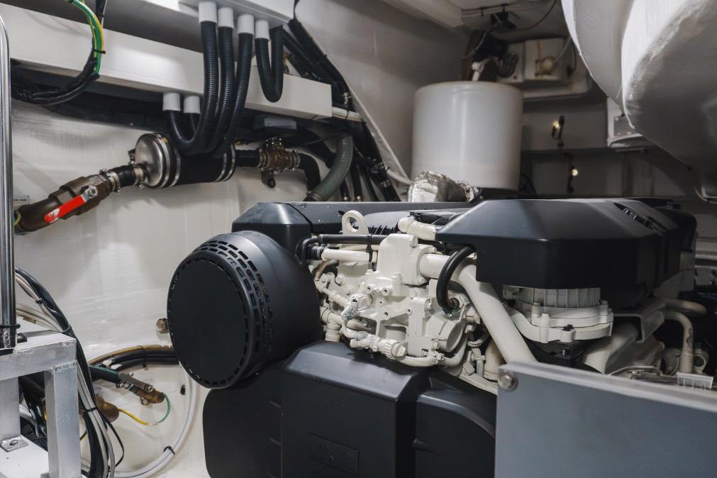 Engine room of a 2020 Azimut 60 yacht, showcasing mechanical components and piping.