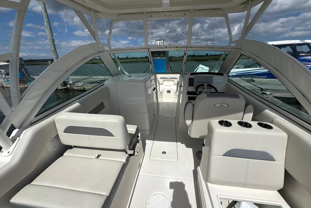 Interior of 2025 Sailfish 245 DC boat with seating and steering console.