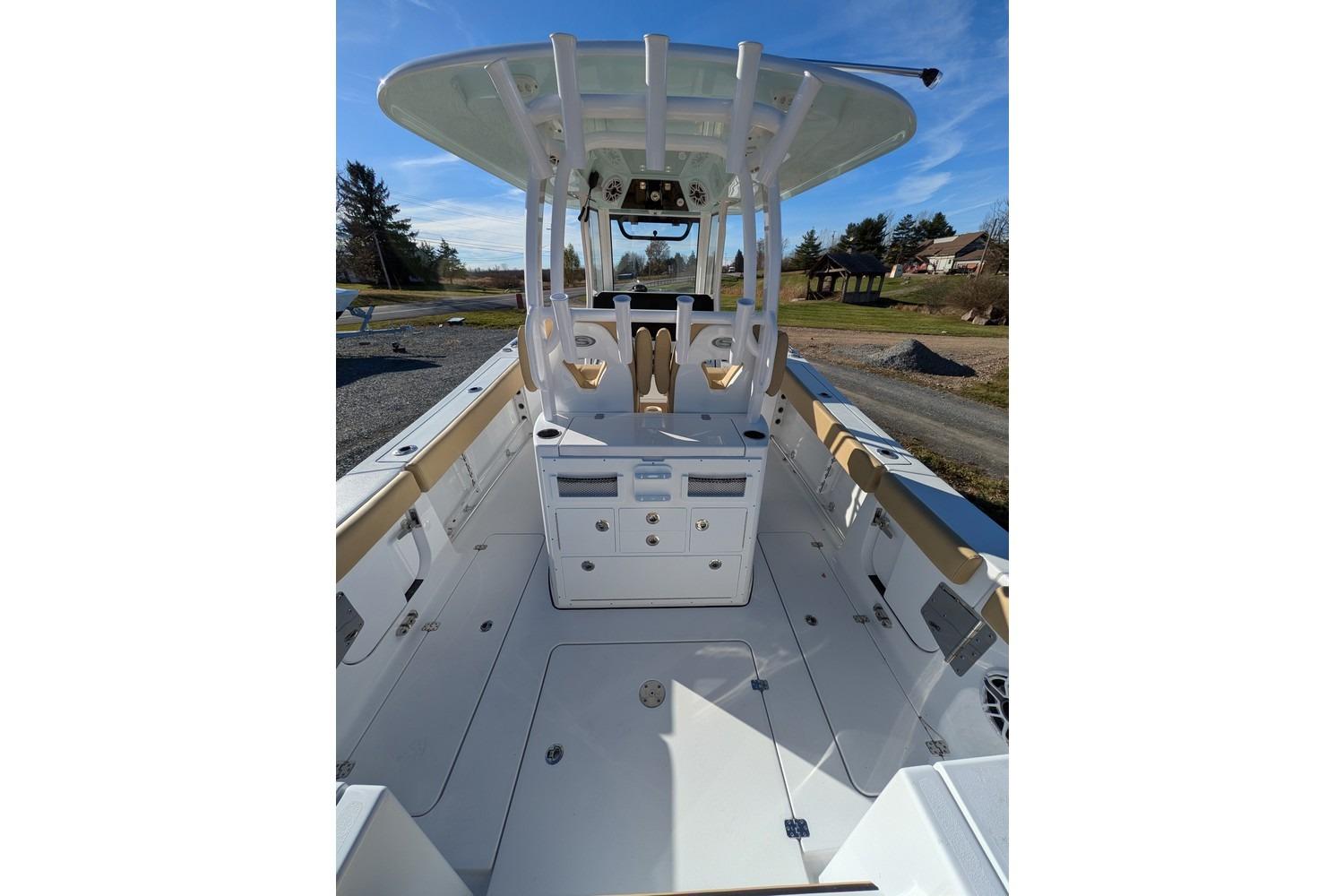 2025 Sportsman Open 282 Center Console boat interior with helm and seating.
