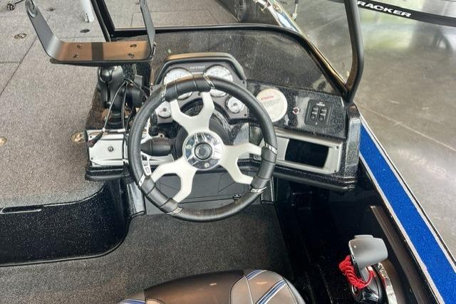 Steering console of a 2025 Nitro ZV21 Pro boat, featuring modern controls and gauges.