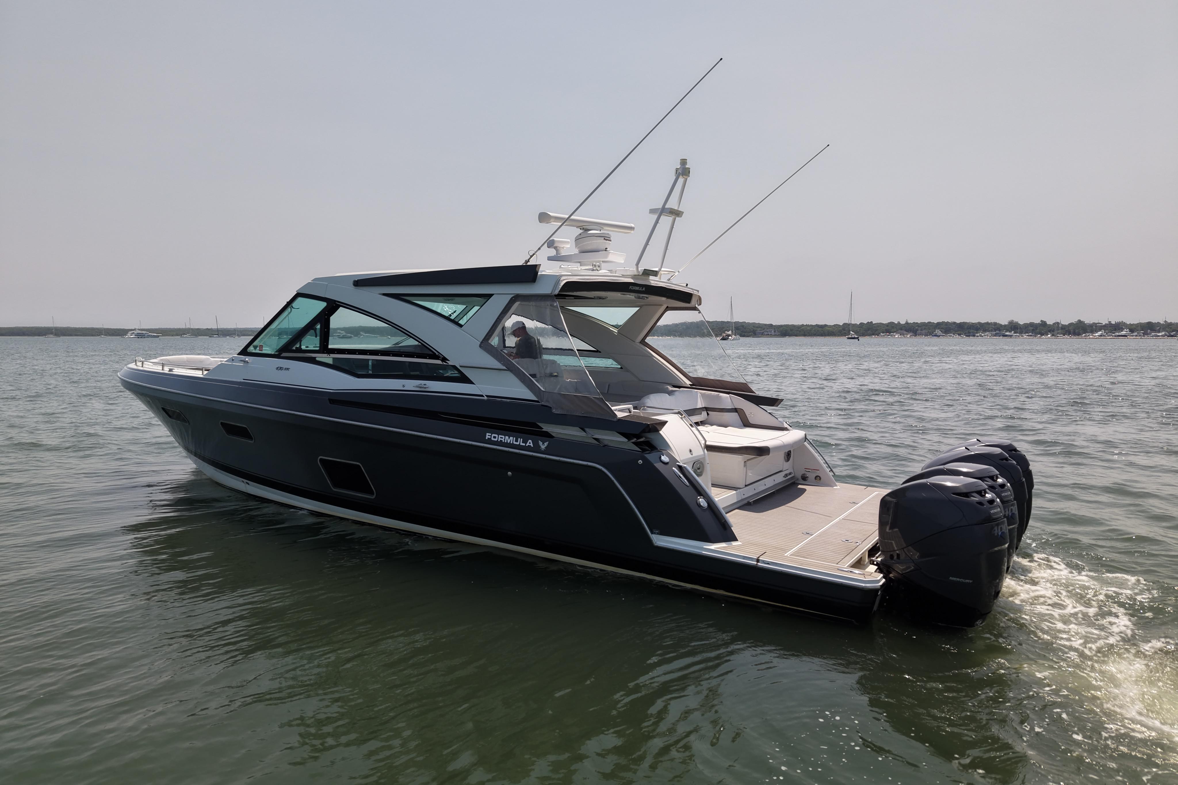 2019 Formula 430 Super Sport Crossover boat cruising on calm waters.