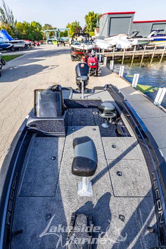 2024 Recon 985 SC fishing boat docked at a marina.