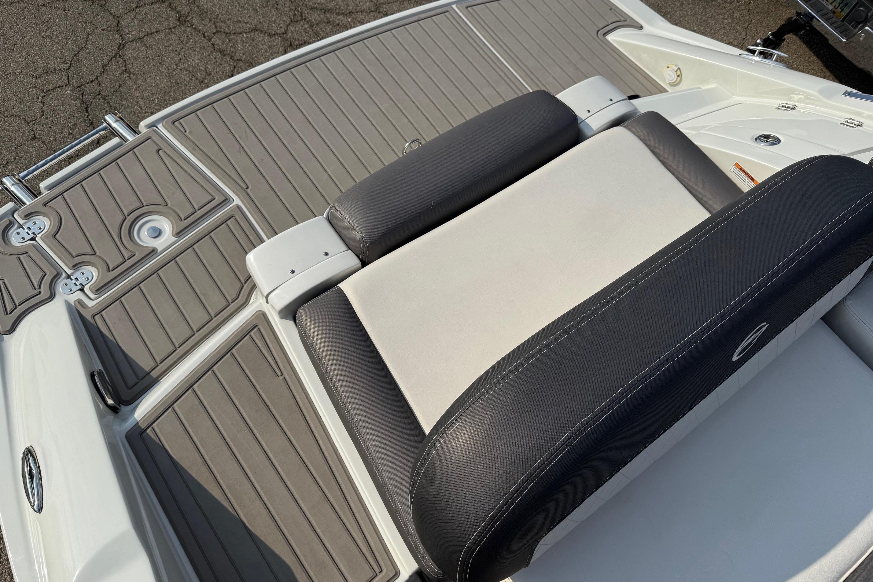 2023 Crownline 260 SS boat with sleek seating and textured deck design.