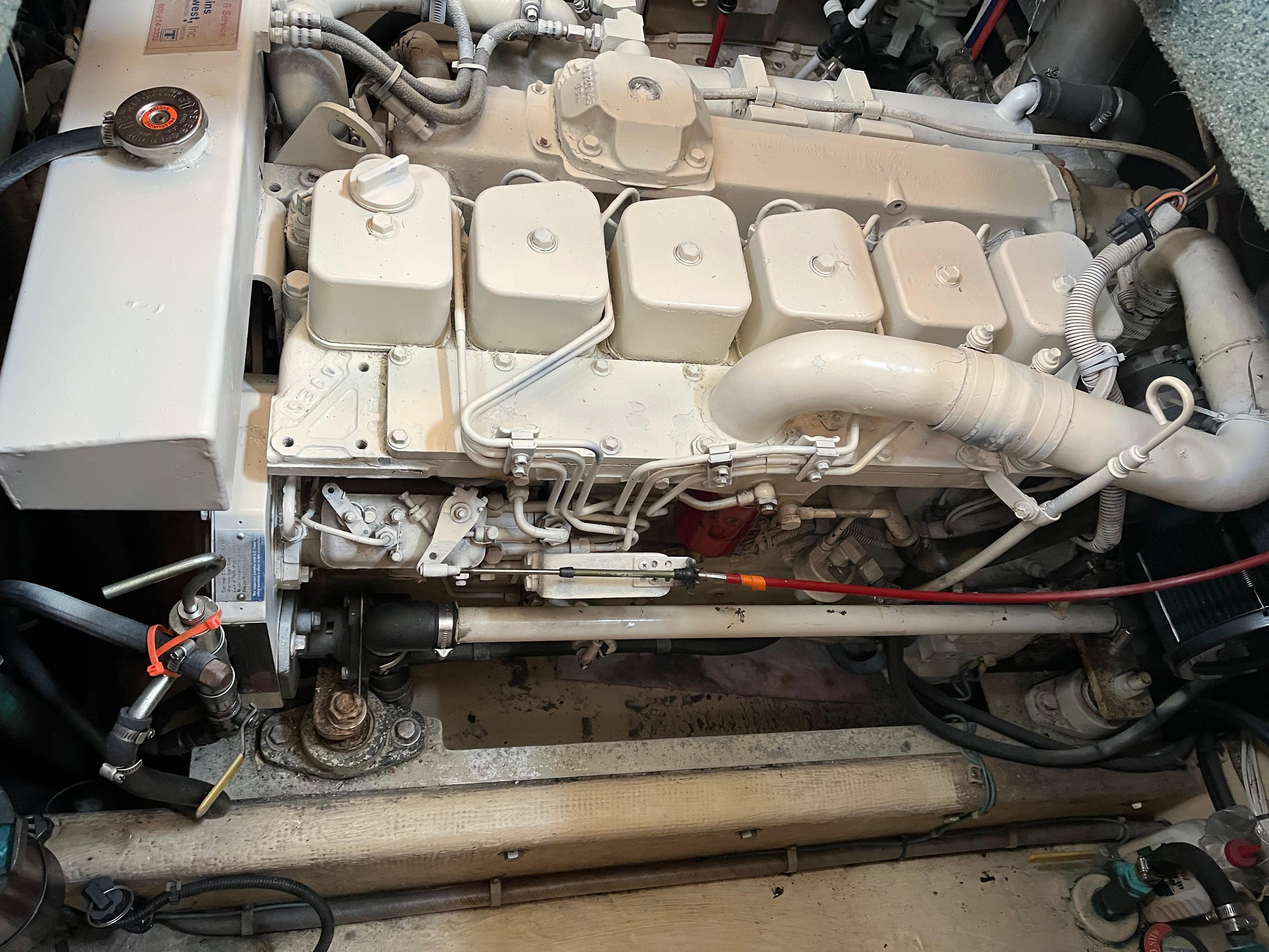 Engine compartment of a 1998 Nordic Tug 32, showcasing detailed mechanical components.