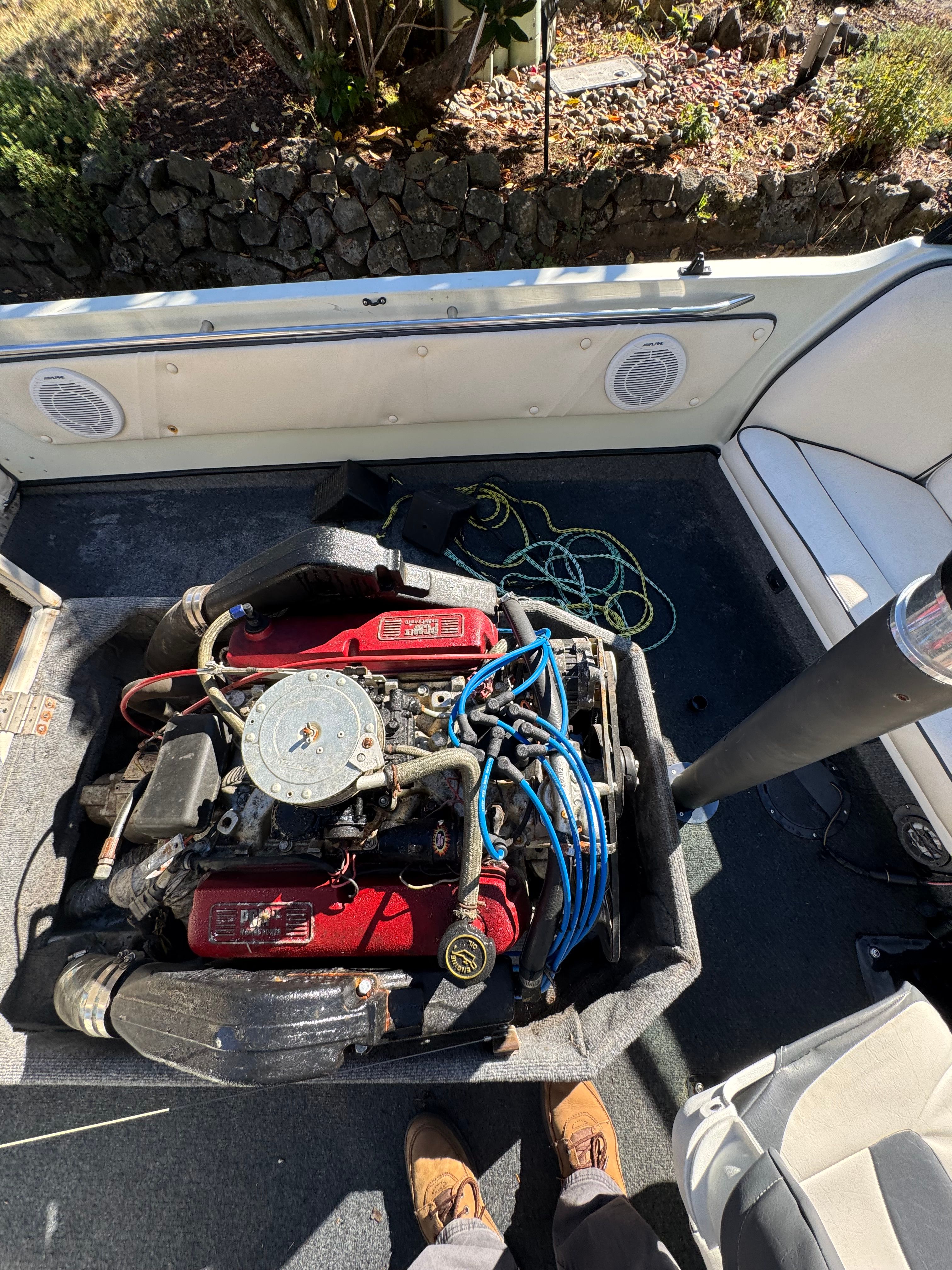 1990 Supra TS6M motorboat with open engine compartment.