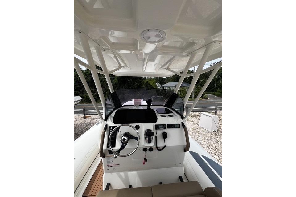 2022 Brig Eagle 8 boat cockpit with steering wheel and controls, featuring a sleek design.
