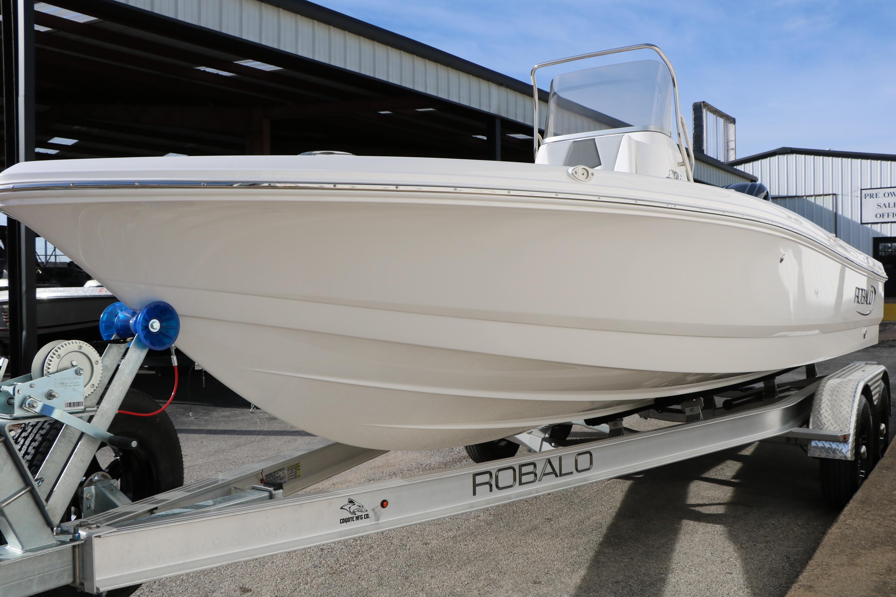 2026 Robalo 206 Cayman boat on trailer, displayed outdoors.