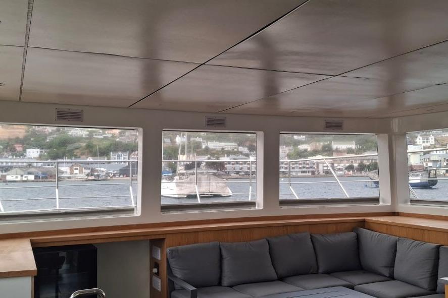 Interior of Leeuwin 55 yacht, 2024 model, with harbor view.